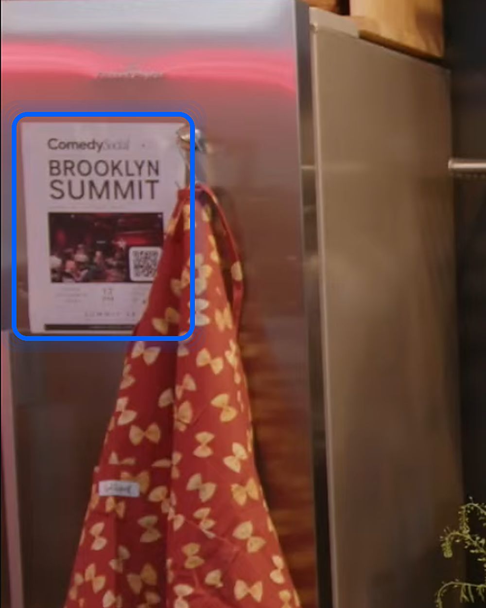The kitchen fridge on set, with a partner flyer circled